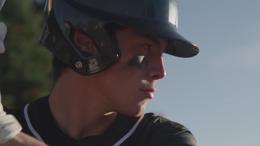 A batter prepares to swing at the plate