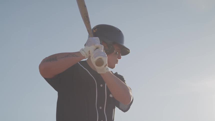 Baseball player getting ready to swing at a baseball game