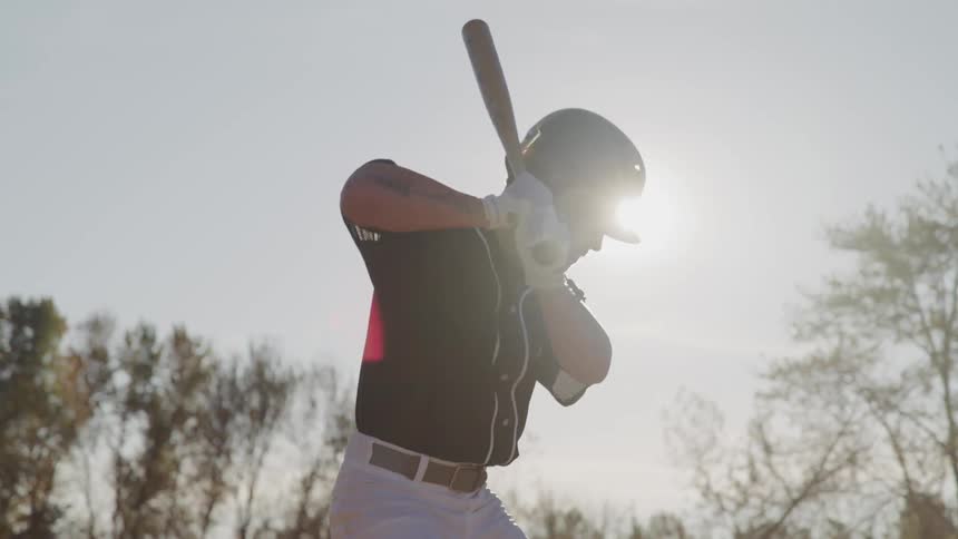A batter takes a practice swing