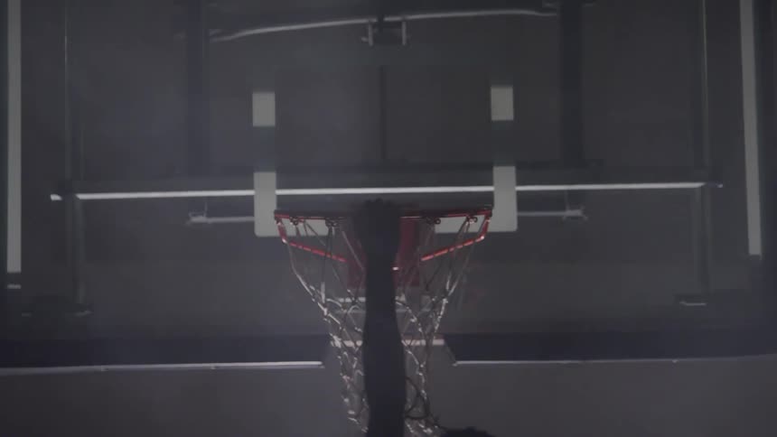 A person dunks the basketball