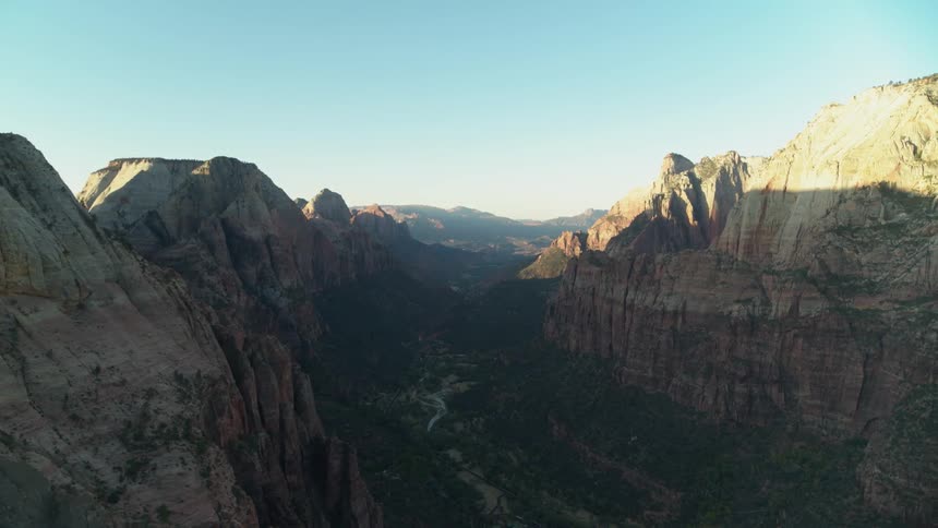 A gorge runs through tall canyons