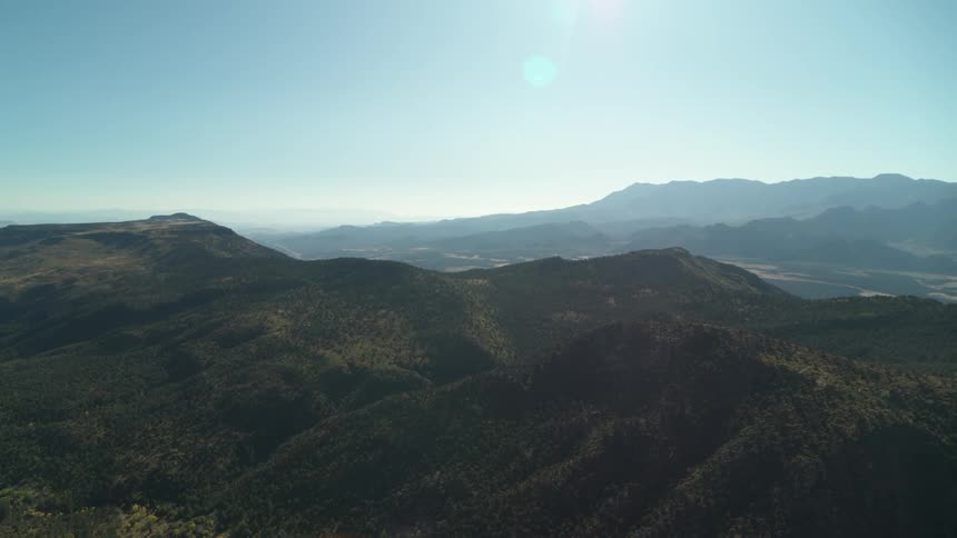 A verdant mountain ridge during the day