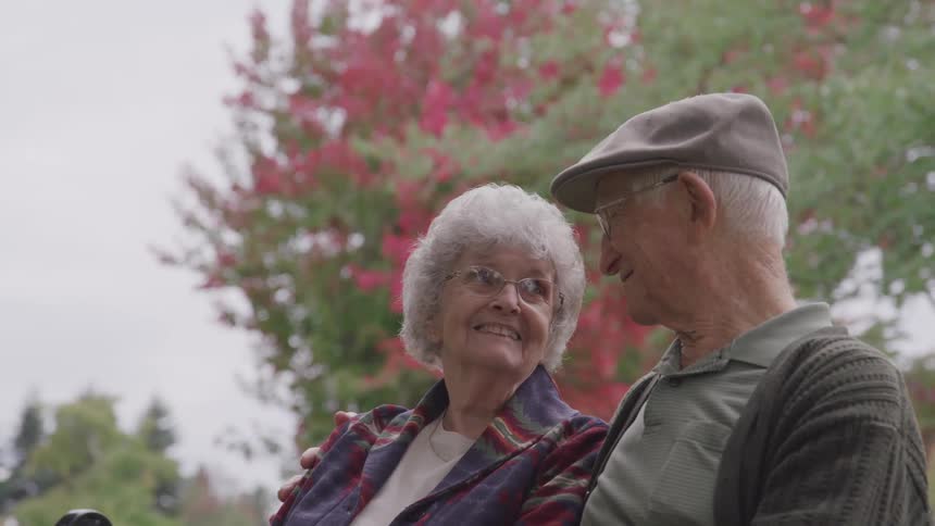 A man and a woman look lovingly into each others eyes