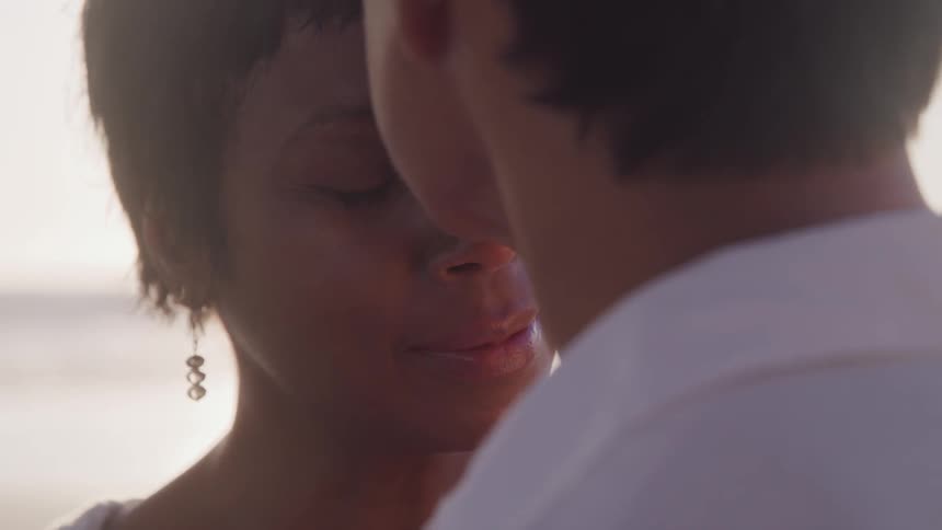 A man kissing his wife