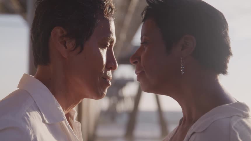 Husband and wife are standing close to each other