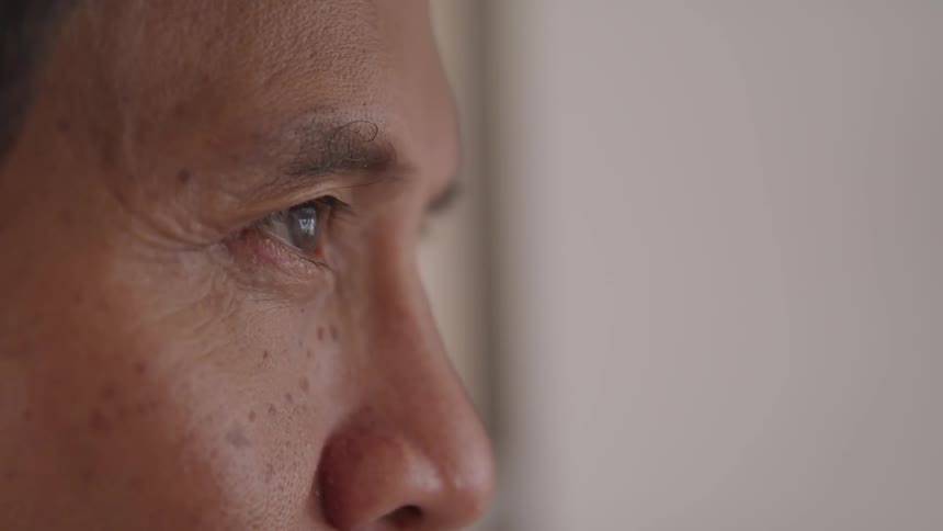 Close up profile of older person looking at something