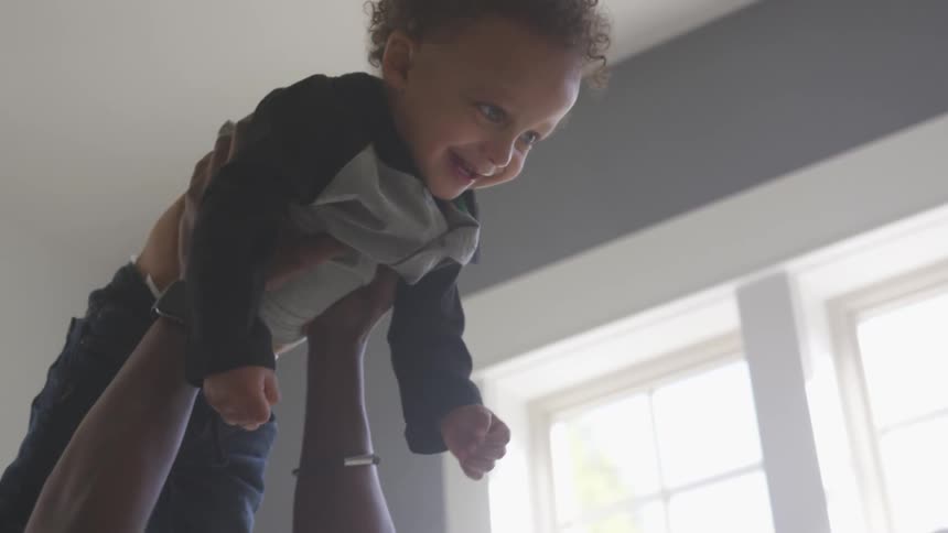 Father and son playing in the house
