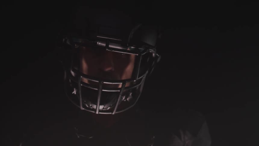 A man sits in his helmet