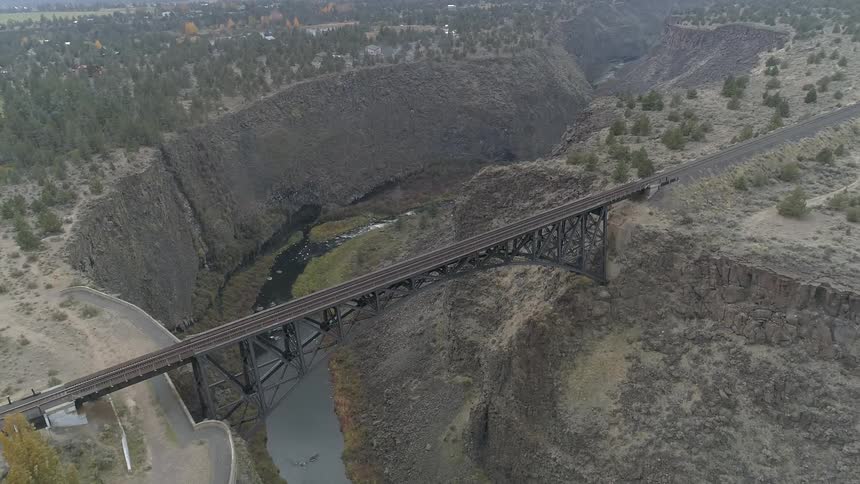 An aerial footage of a train rail bridge
