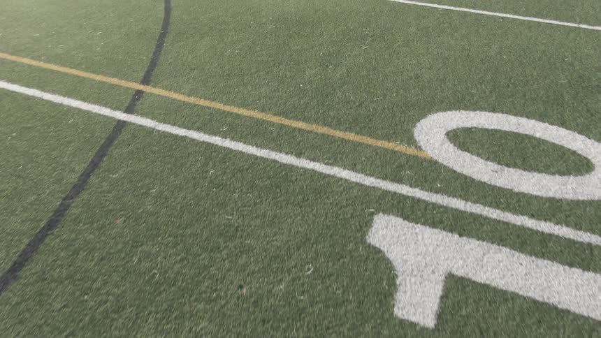 Painted lines on a football or soccer field