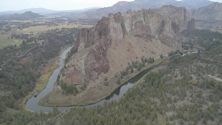 A mesa surrounded by a river in the countryside