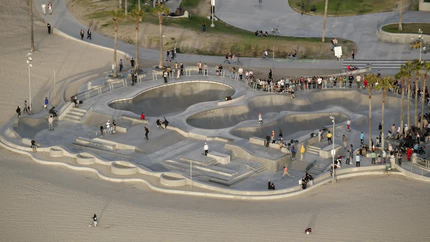 An aerial footage of a skatepark full of people