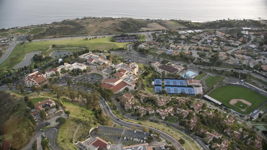 Aerial footage of a campus by the ocean