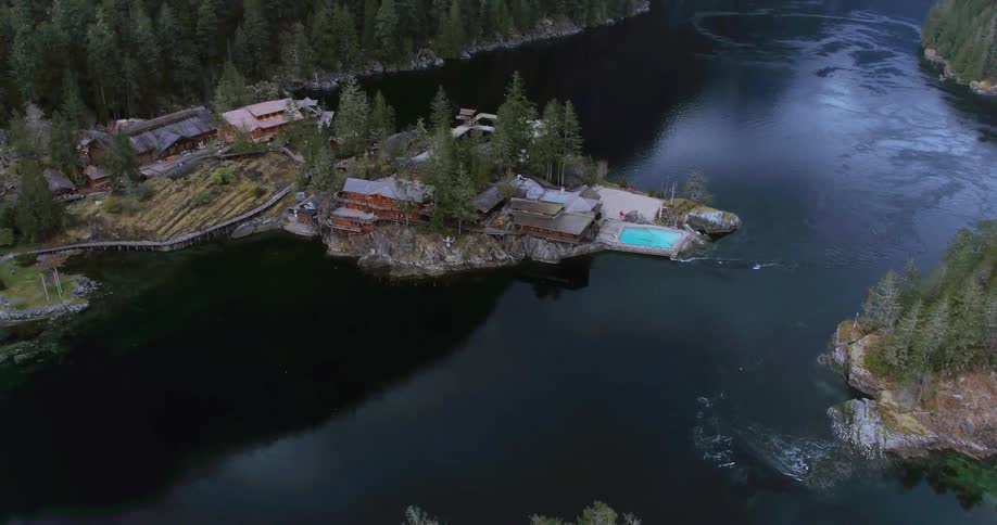 Homes line the river in a rural area