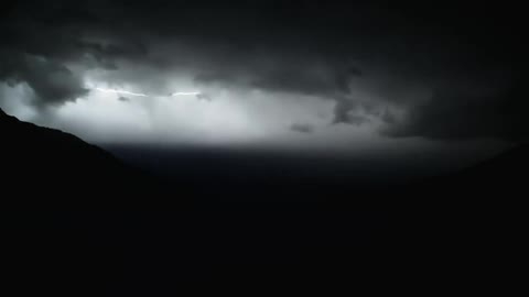 Several lightning bolts flashing across the dark sky