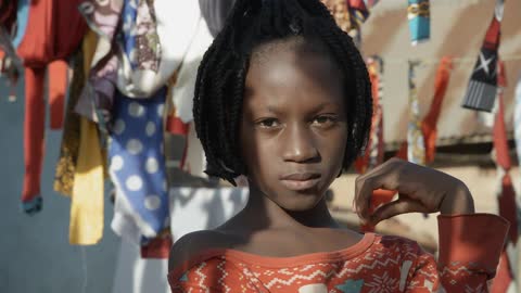 A portrait of a black girl in the rural country
