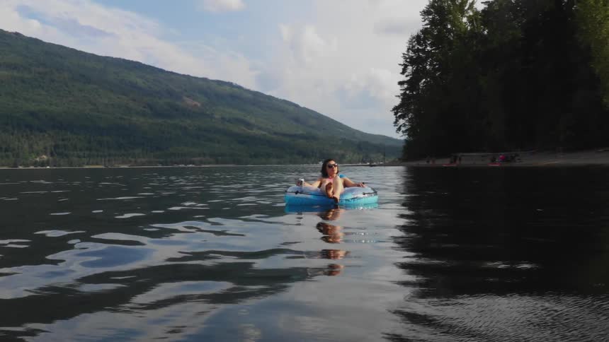 A woman floats on the water