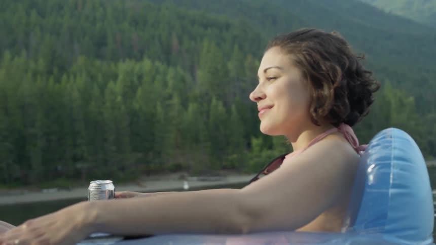 A beautiful woman enjoying trip on a lake