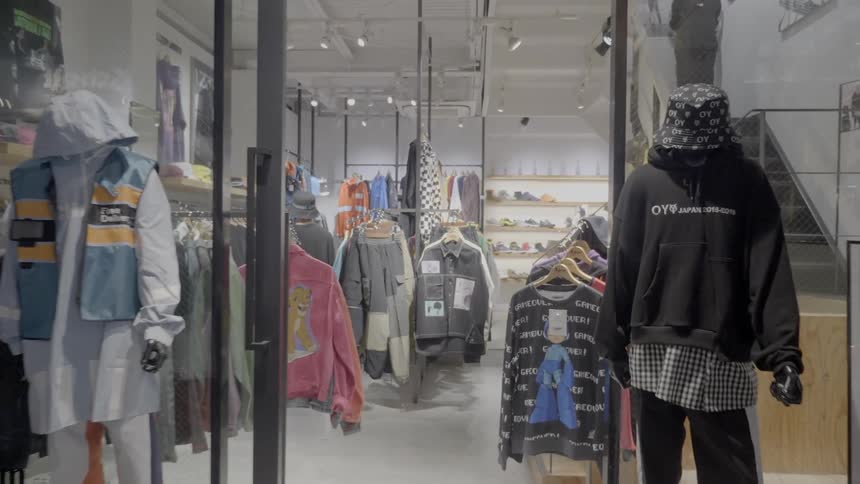 A retail store is filled with numerous pieces of trendy and fashionable street clothing