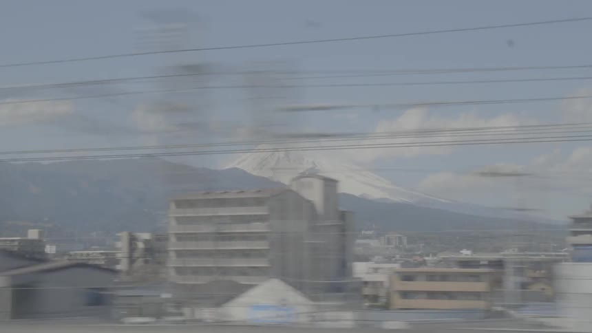 A footage of city skyline from a train window