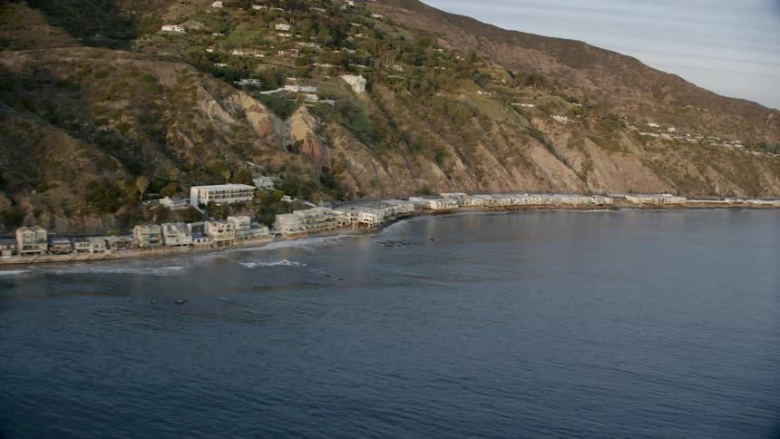 Beach homes line the ocean along the Pacific Coast Highway