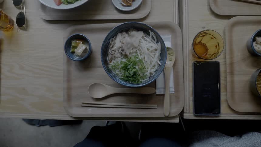 People sit down in a restaurant preparing to eat