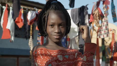 A portrait of a young black girl in the rural area