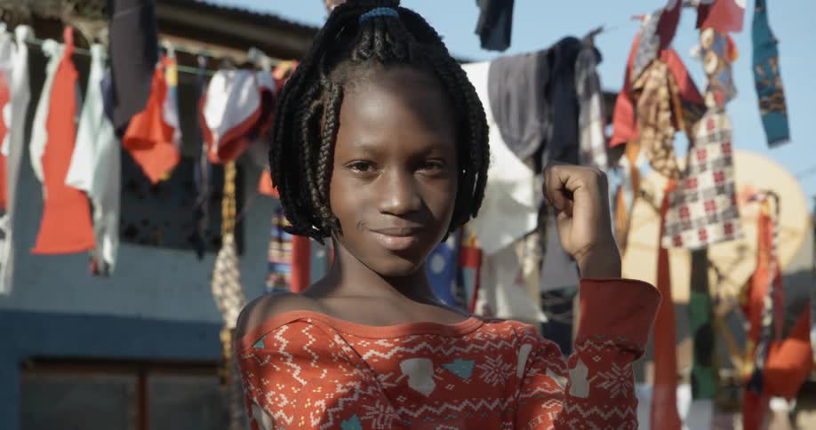 A portrait of a young black girl in the rural area
