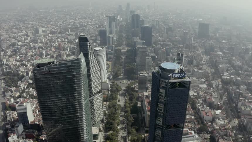 The city is covered with smog and vehicles traveling