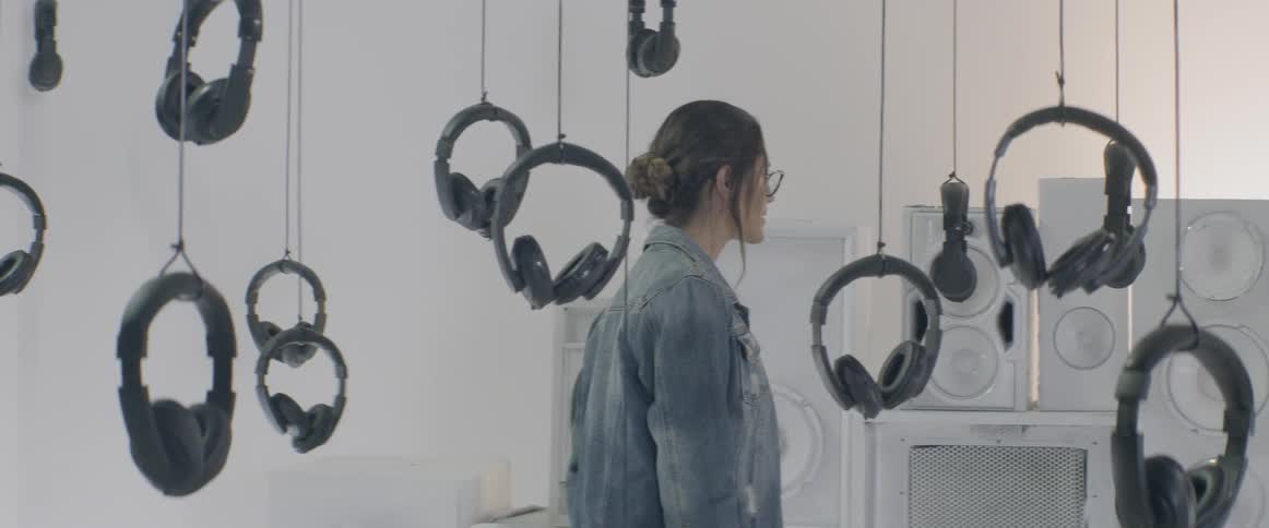 A woman looking at the art installation