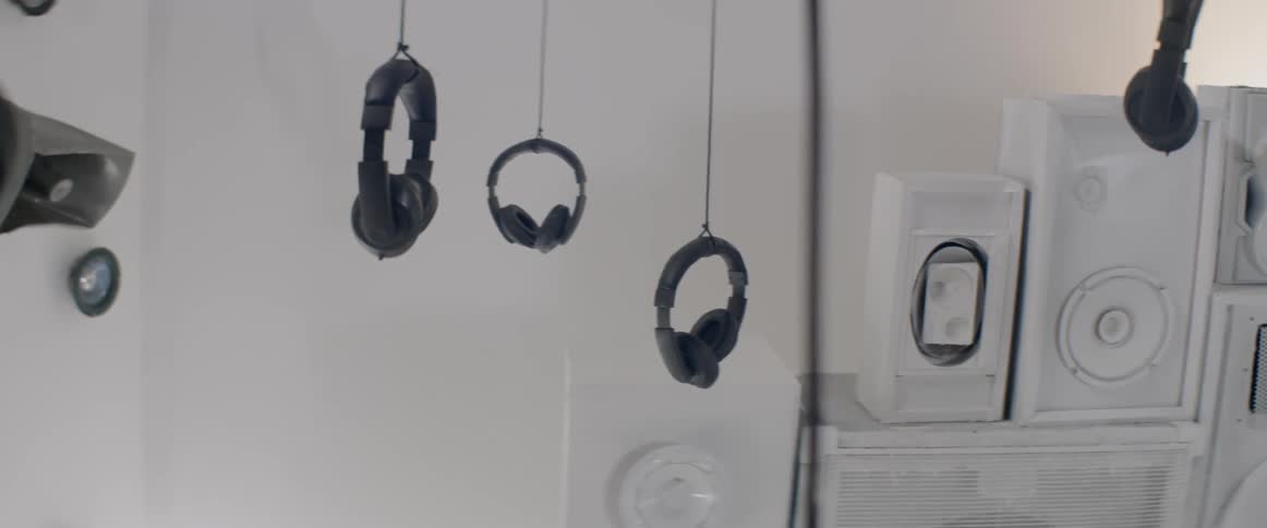 Headphones and speakers make up a modern art display