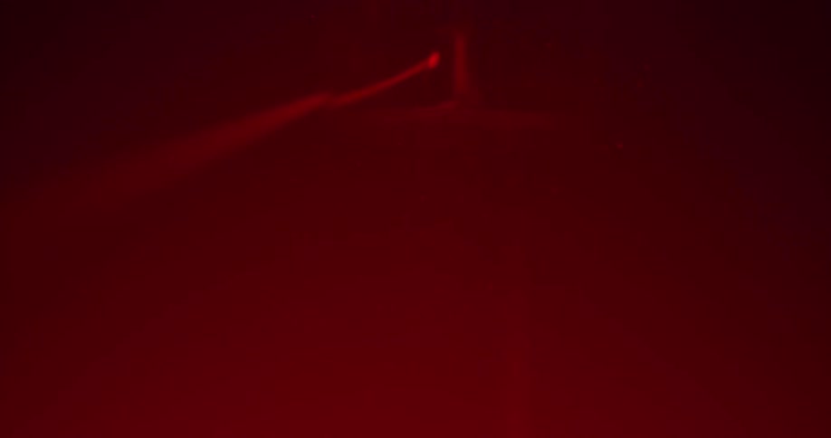 The laser shines through the fog
