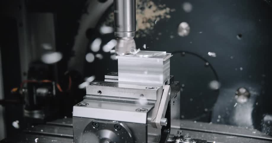 A drill bit drilling into steel