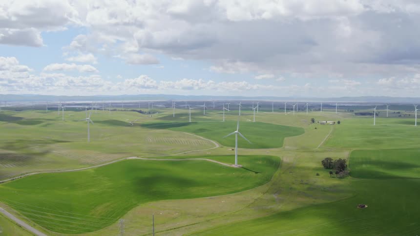 Farmland is dotted with wind turbines