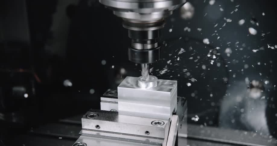 A machine is drilling into a piece of metal
