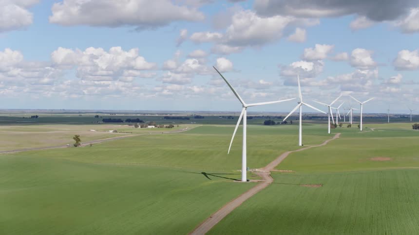 A scenery of a wind turbine at the sunny day