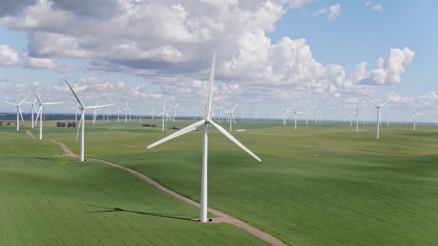Windmills are supplying energy to the farmland area