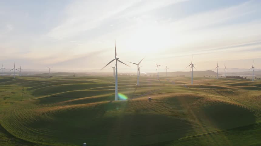 Windmills are spinning in a rural area for energy