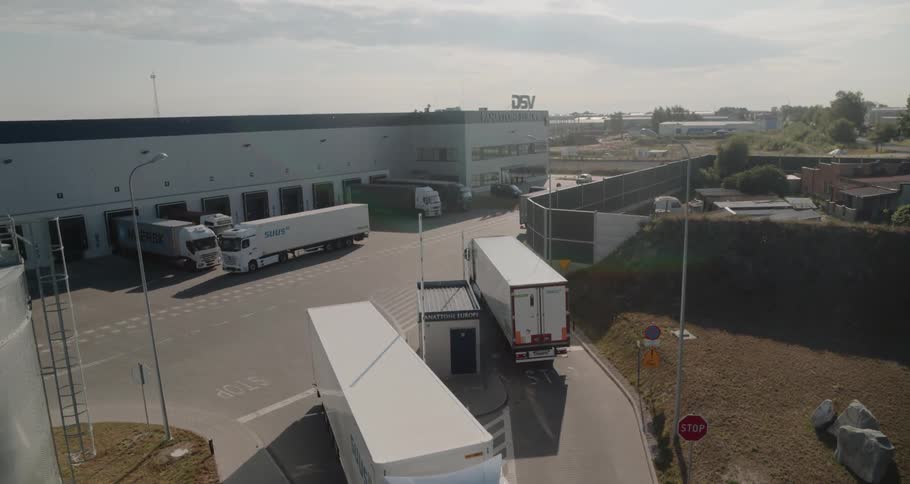 The trucks drive to and from the warehouse