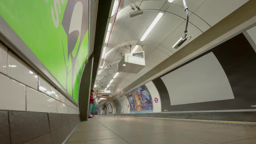 Time lapse of people at a an underground subway platform