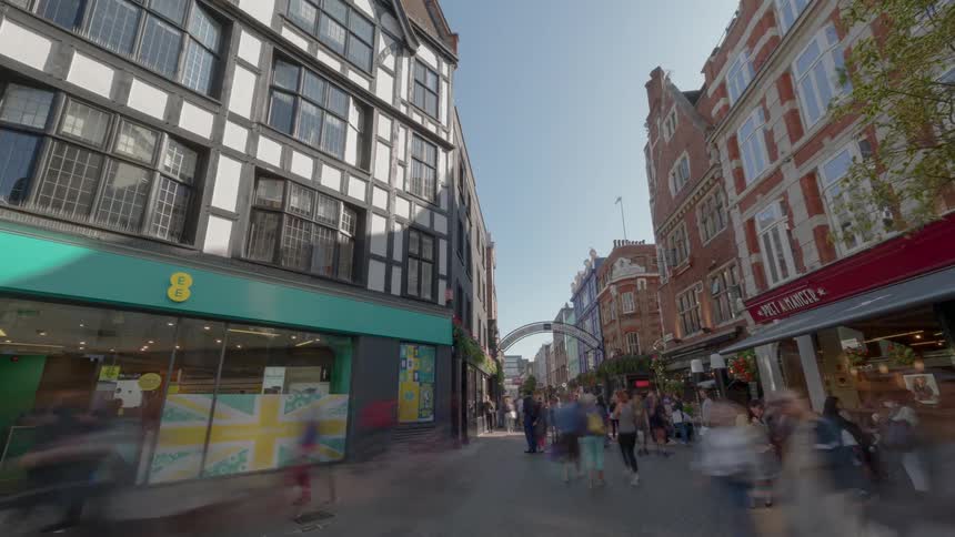 People stroll and go shopping in the centre of the city