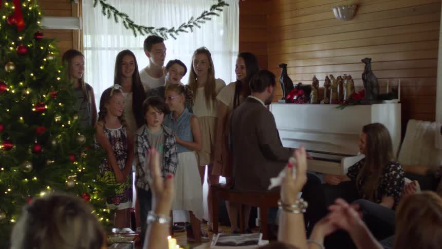 A group of children singing at a christmas party
