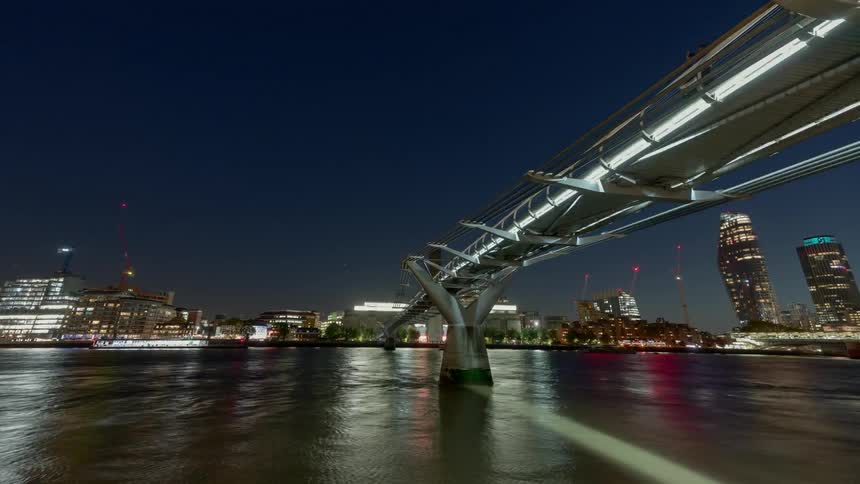 A time lapse scenery of a bridge at night