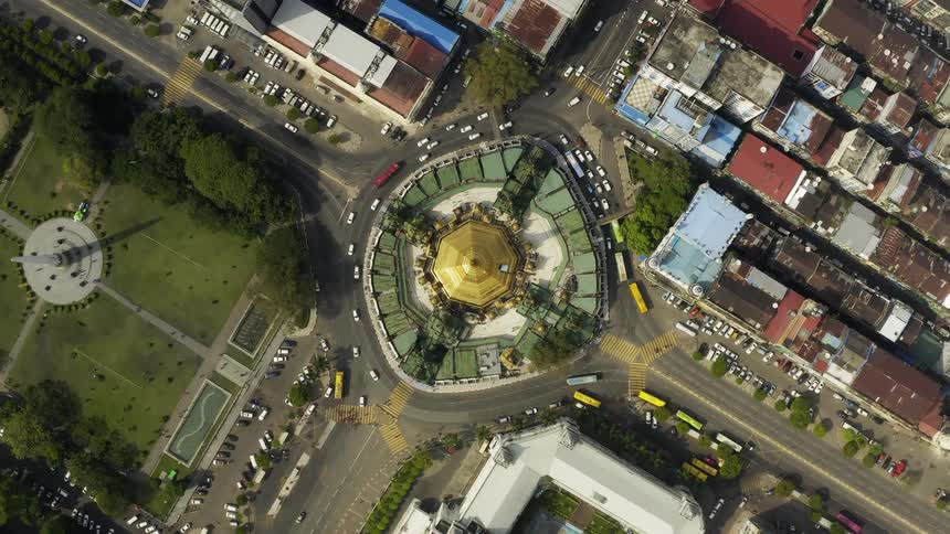 A roundabout in the middle of a town street