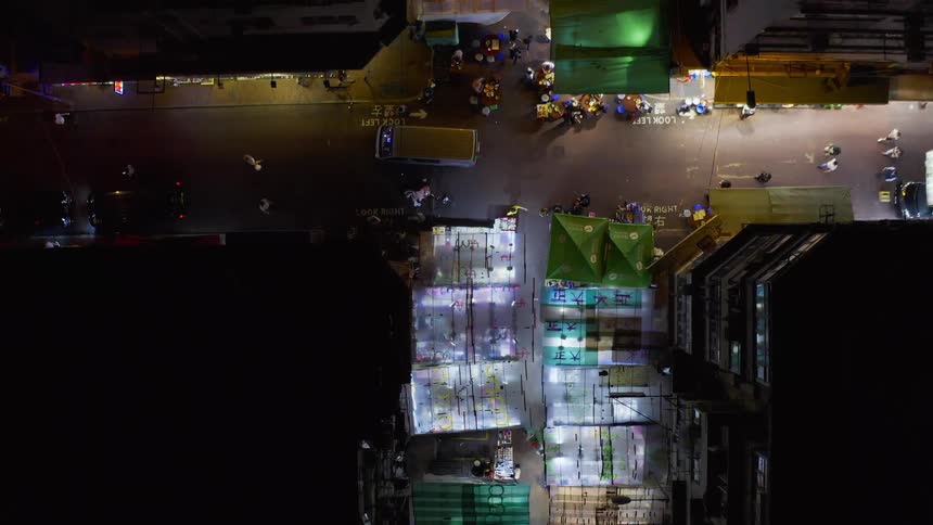 Birds eye view of a busy city street at night