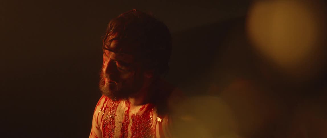 A man covered in blood
