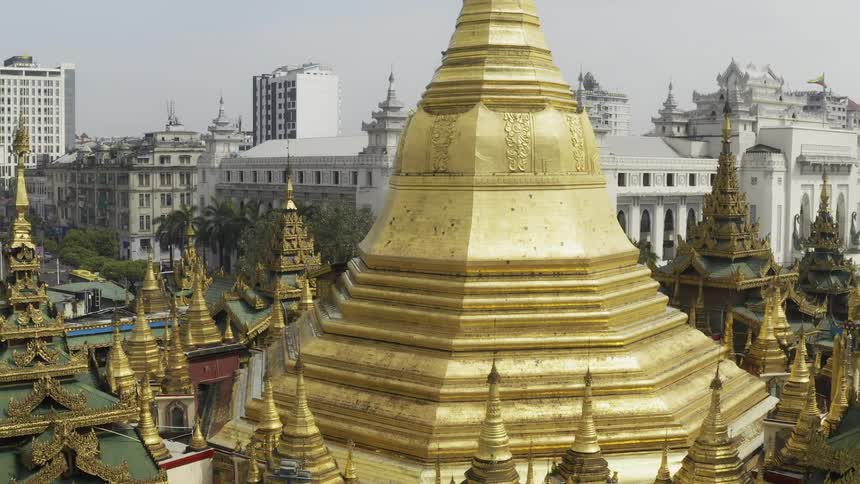 A temple with buildings in the background