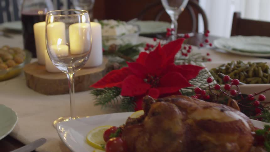 Platters of food on a table decorated for the holidays