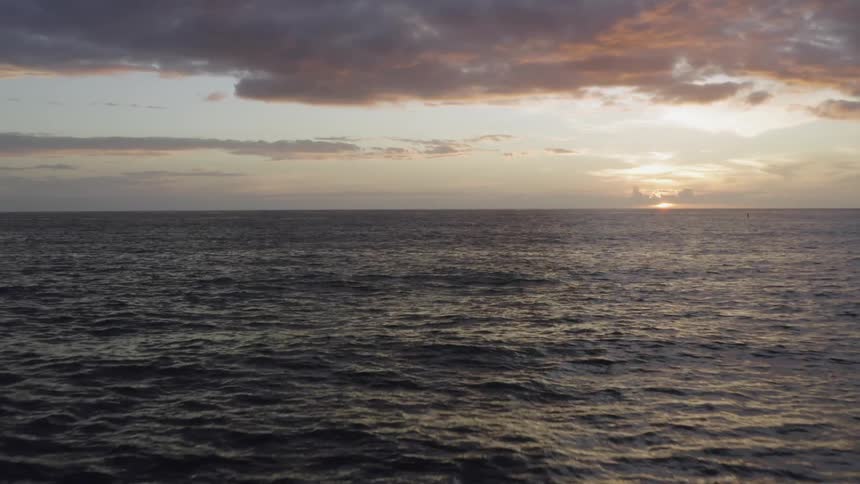 A footage of a wide ocean at dawn