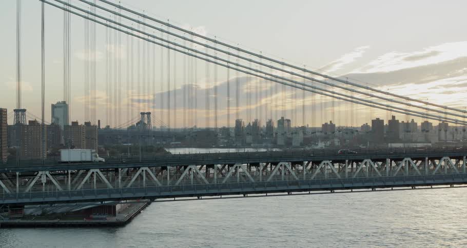 A large suspension bridge serves to connect vehicle traffic to a major metropolitan city